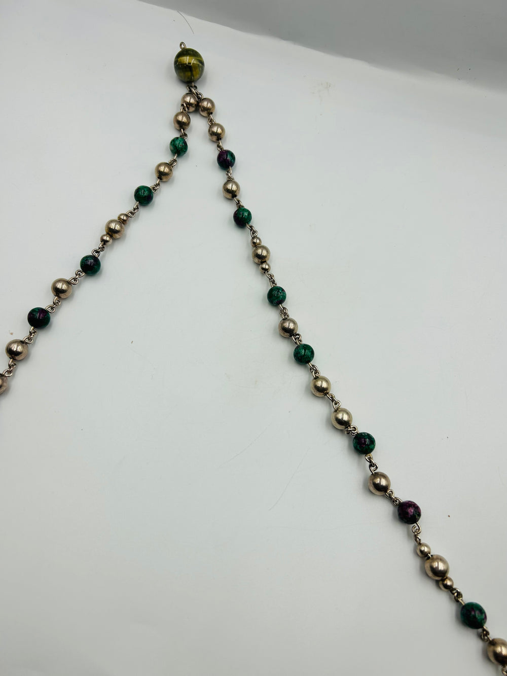 Unisex  extra long necklace of big silver beads and ruby zoisite.